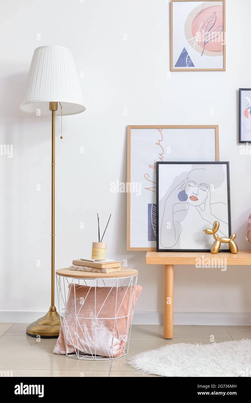 Interior of stylish living room with pictures Stock Photo - Alamy