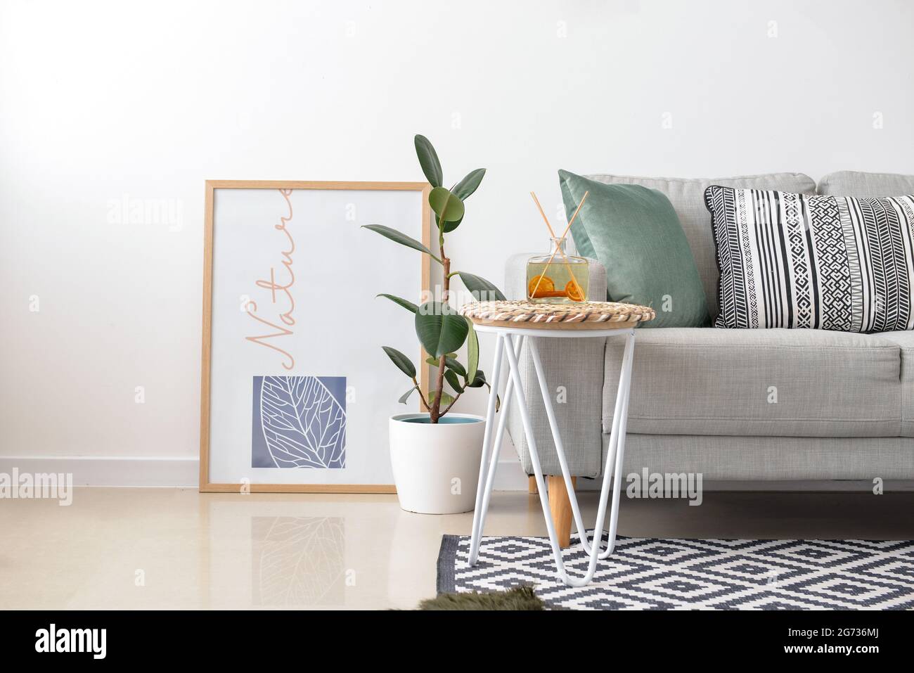Interior of stylish living room with picture Stock Photo - Alamy