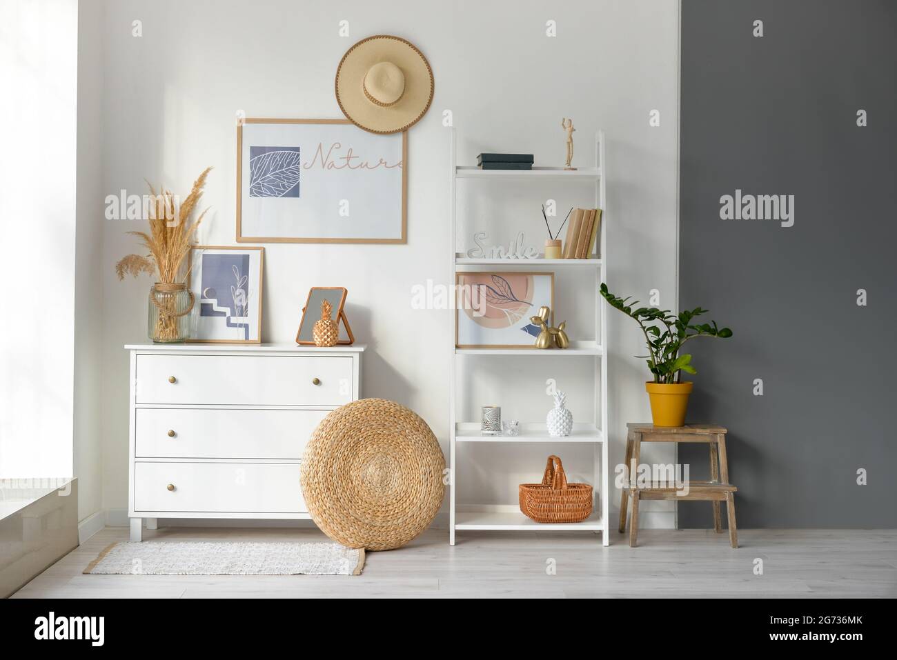 Interior of stylish living room with pictures Stock Photo - Alamy