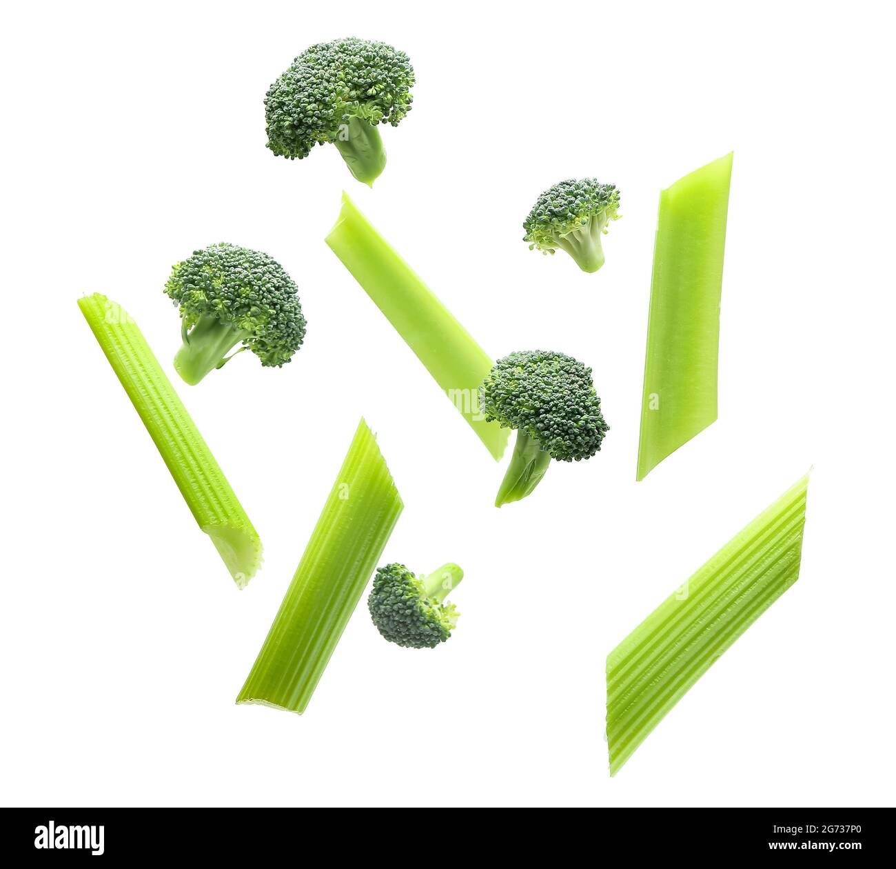 Flying celery and broccoli on white background Stock Photo - Alamy