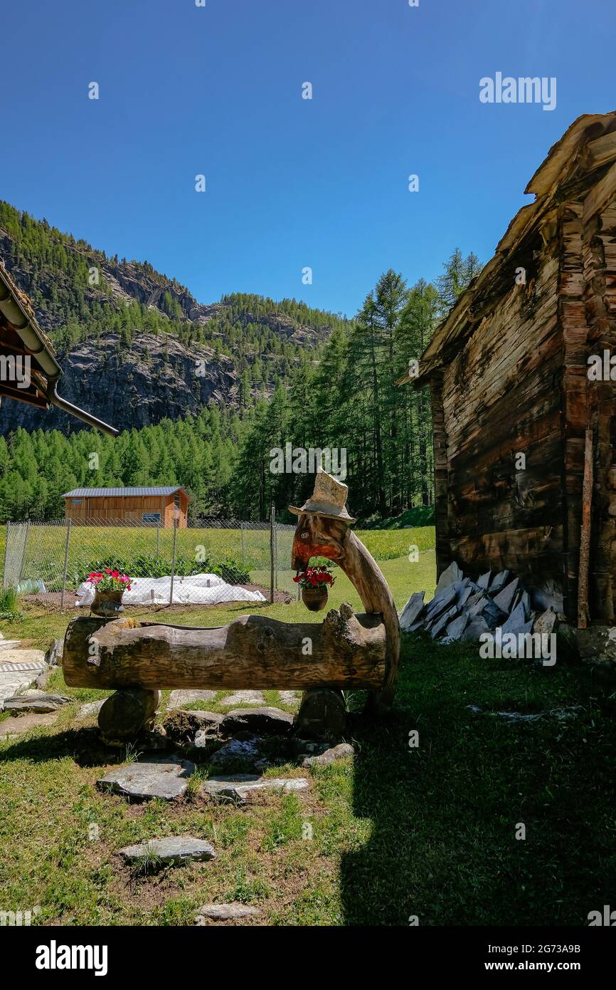Water Fountain Carved in Wood Swiss Alps Zermatt, Switzerland Stock