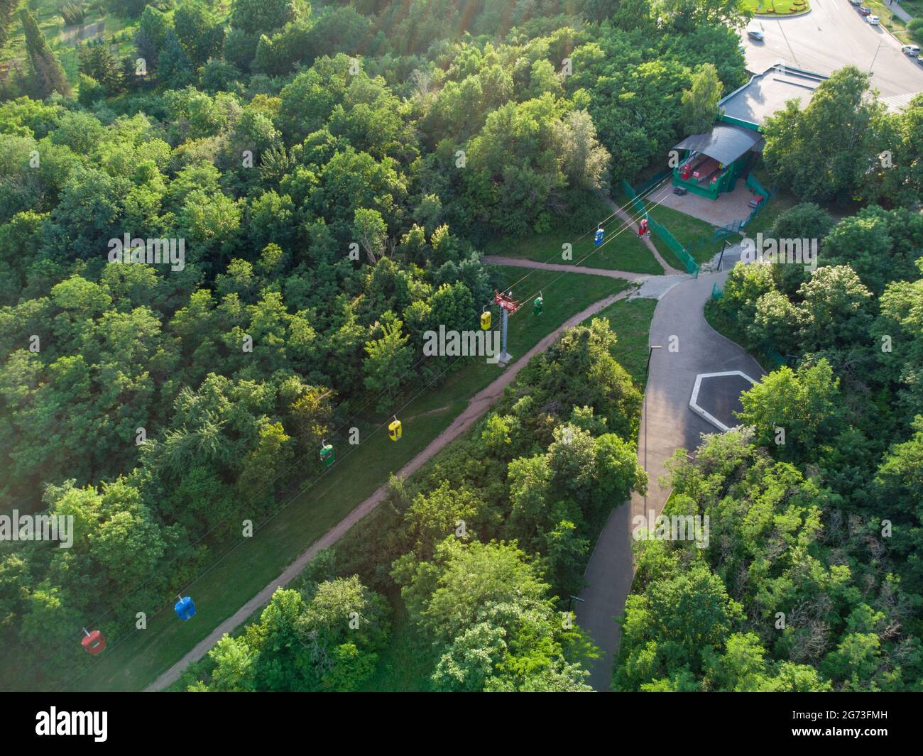 Cable car attraction station aerial view in green summer Kharkiv city popular recreation Central Park, Sarzhyn Yar Stock Photo