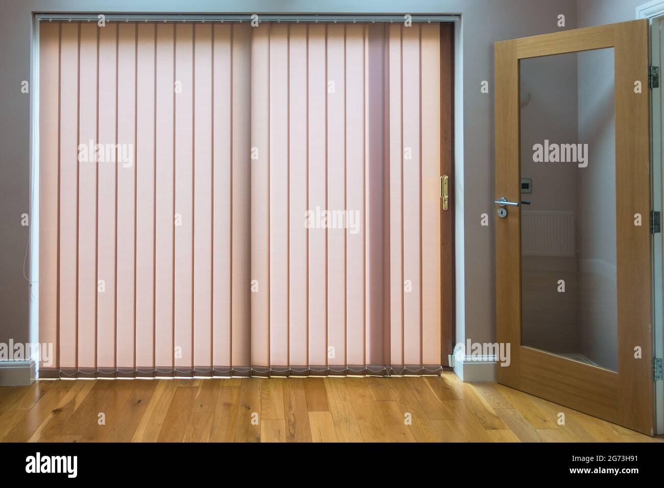 Vertical blinds in a property patio windows Stock Photo
