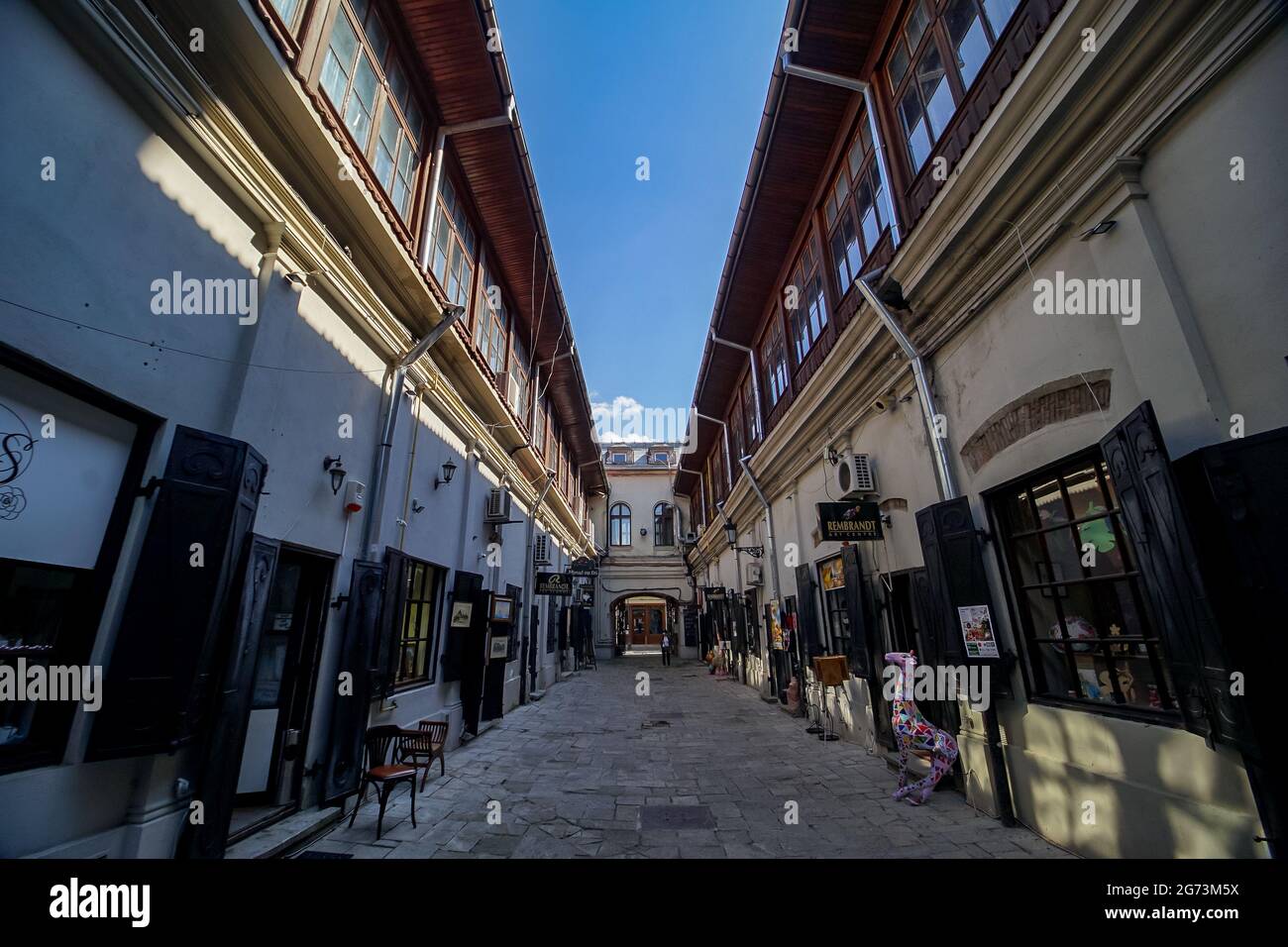 Bucharest, Romania - July 08, 2021: 'Hanul cu tei', built in 1833, which in the past it was an inn now is a place with small shops and art galleries, Stock Photo