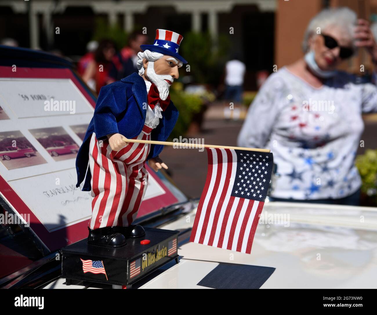 A flag-waving Uncle Sam doll on the hood of a 1950s Ford Fairlaine on display at a Fourth of Juy classic car show in Santa Fe, New Mexico. Stock Photo