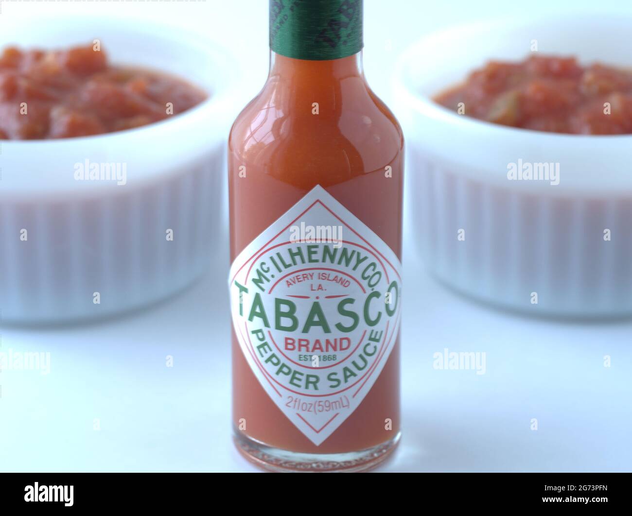 Red Tabasco sause with box and two bowls of salsa Stock Photo - Alamy
