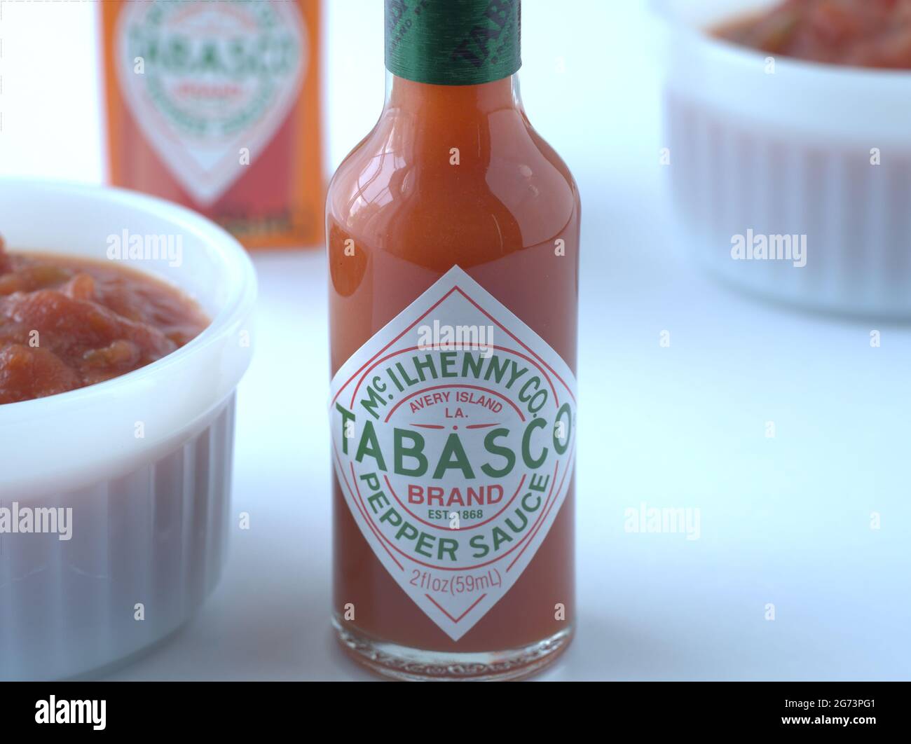 Red Tabasco sause with box and two bowls of salsa Stock Photo - Alamy