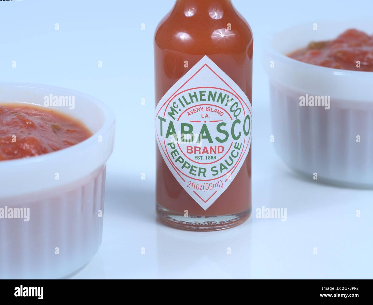 Red Tabasco Sauce bottle and two bowls of salsa Stock Photo - Alamy