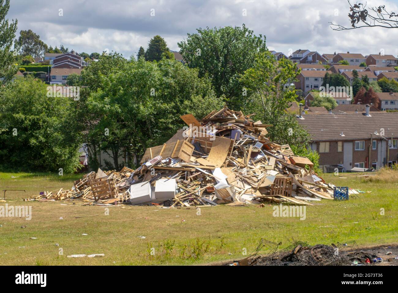 9 July 2021 Flammable household waste that has been dumped for burning on the protestant bonfire in Kilcooley housing estate as part of the annual 169 Stock Photo