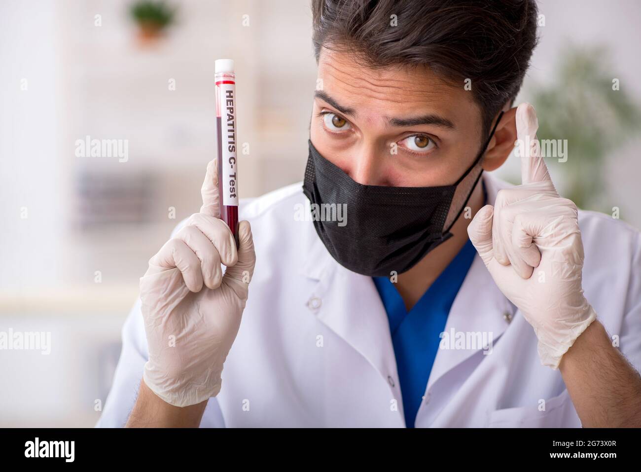 Young biochemist testing blood samples Stock Photo