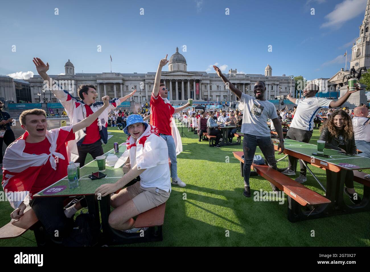 EURO 2020: England vs Denmark. England supporters watch the big screens in Trafalgar Square as England takes on Denmark for the semi-finals. London UK Stock Photo