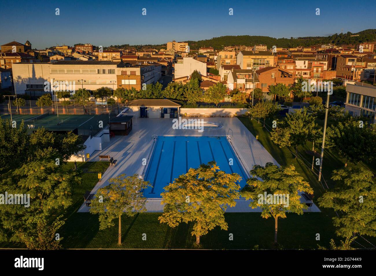Aerial view of the tennis courts and municipal swimming pools of Navàs at sunrise (Bages