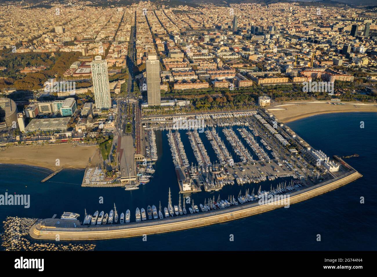 Aerial view of Torres Mapfre (twin towers) and the Olympic Port in the Vila Olímpica district, in Barcelona, at sunrise (Barcelona, Catalonia, Spain) Stock Photo