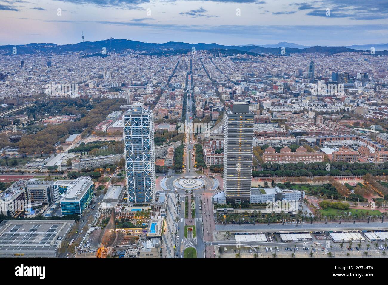 Aerial view of the Torres Mapfre (twin towers) in the Vila Olímpica district, in Barcelona, at twilight - sunrise (Barcelona, Catalonia, Spain) Stock Photo