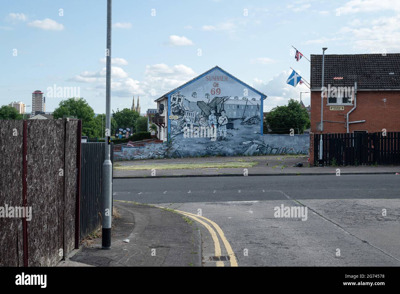 The ìSummer of '69î mural at Hopewell Crescent off the Crumlin road in the Shankil estate, which depicts the devastation which occurred during the Summer of 1969.Communities on both sides fear a return to a volatile state in the North due to fresh tensions as a result of post Brexit protocols. Preparations in lieu of July 11th bonfire night in Belfast before the annual July 12th Orange Order marches. This year marks the centenary of the formation of Northern Ireland and is also the first permitted Orange marches since the beginning of the pandemic. The marching season has fallen during a tense Stock Photo