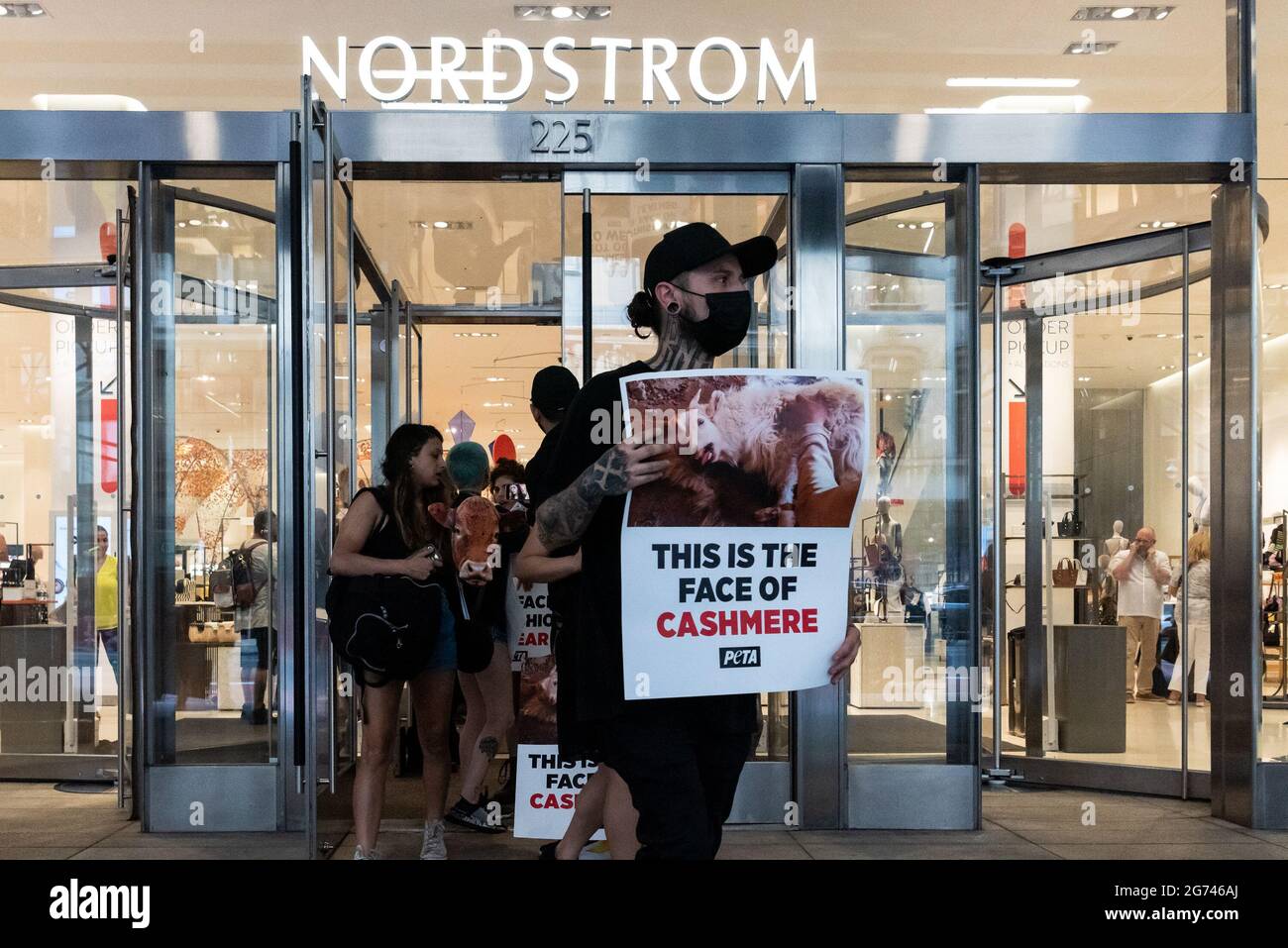 Animal rights activists leave Nordstrom in New York City on July 10, 2021,  after protesting the sale of Urban Outfitters - Free People apparel made of  alpaca, wool, leather, cashmere, mohair, down,