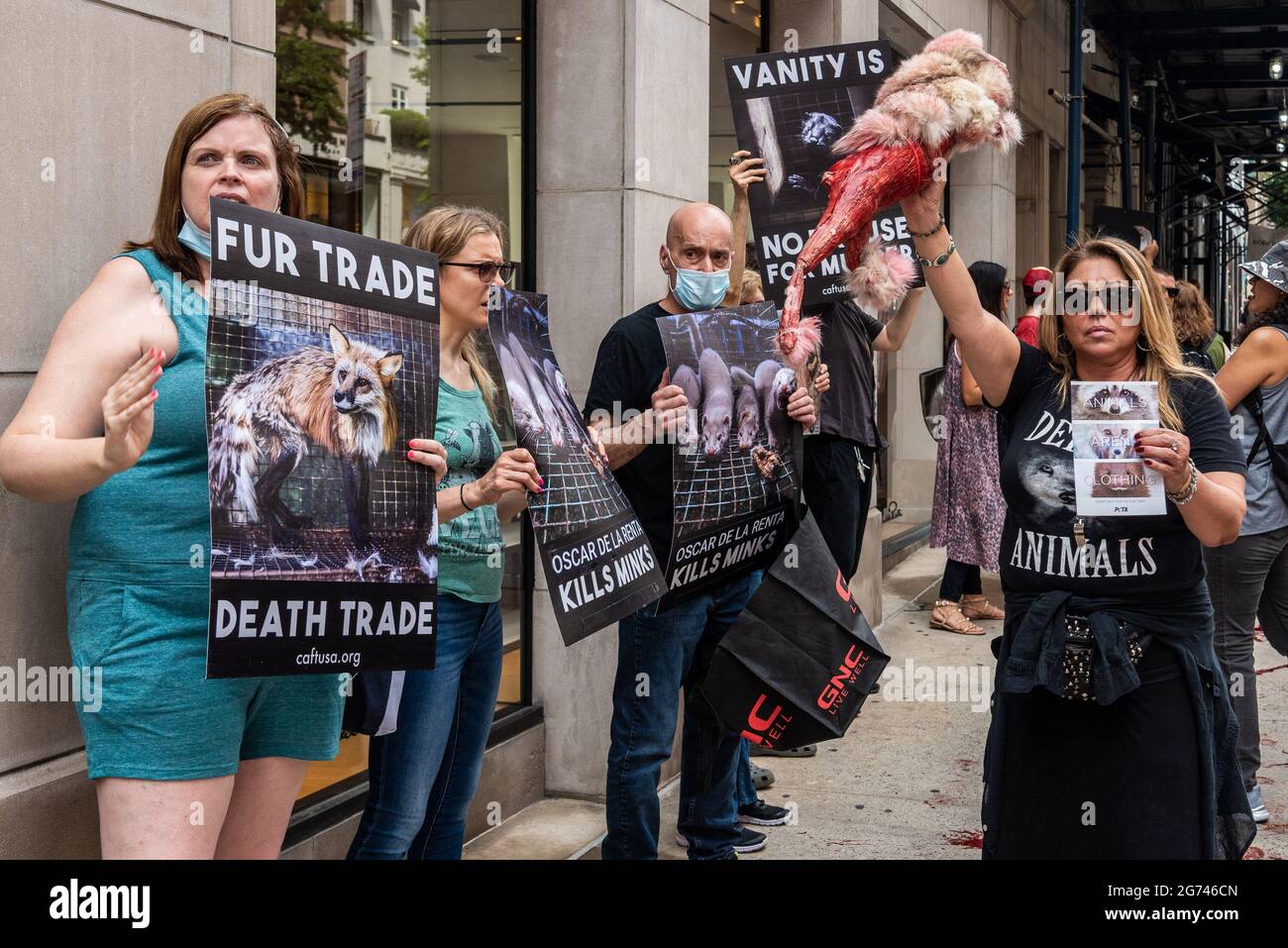 Animal rights activists protest outside designer store Oscar de la Renta in New York City on July 10, 2021. The activists call on the luxury label to join Canada Goose and Saks Fifth Avenue, which recently announced that they would phase out the sale of fur products in their stores. (Photo by Gabriele Holtermann/Sipa USA) Credit: Sipa USA/Alamy Live News Stock Photo