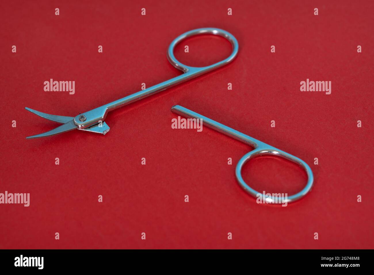 Close-up of a broken nail scissors. Selective focus points. Blurred background Stock Photo