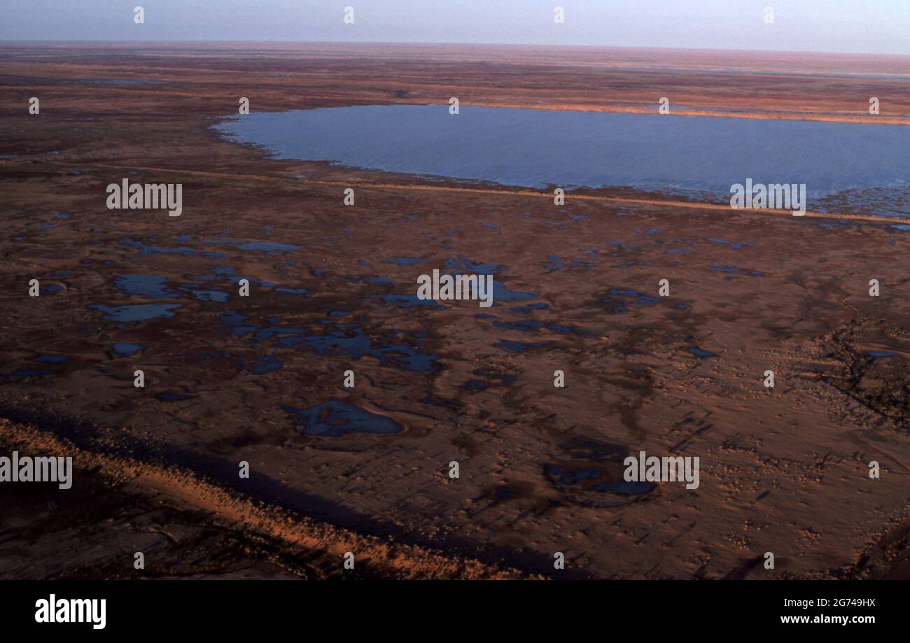 AERIAL OVER THE FLOOD PLAINS OF THE SIMPSON DESERT IN CENTRAL AUSTRALIA. Stock Photo