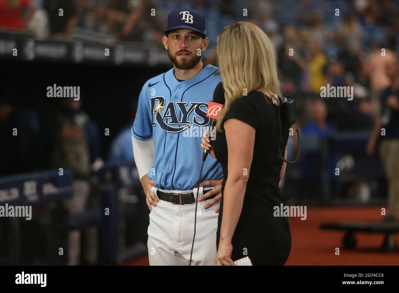 St. Petersburg, FL. USA; Fox Broadcaster Tricia Whitaker interviews Tampa Bay Rays second baseman Brandon Lowe (8) after a major league baseball game Stock Photo