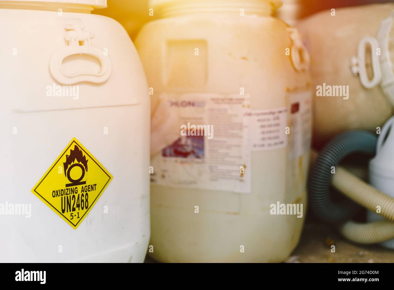 Dangerous chemical Oxidizing agent UN2468 Trichloroisocyanuric acid or Chlorine tank for pool disinfectant. Stock Photo