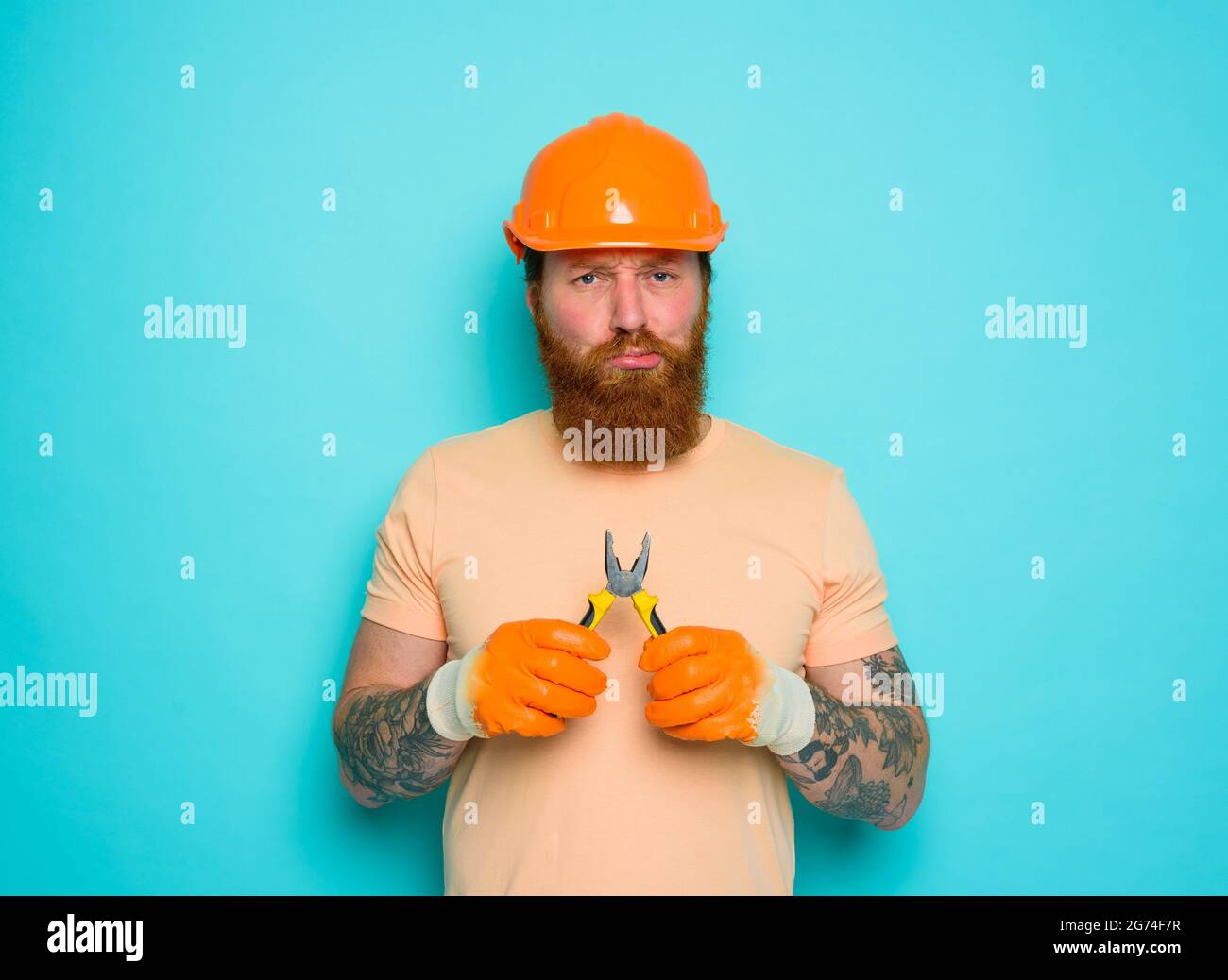 Incompetent worker is unsure and confused about his work Stock Photo
