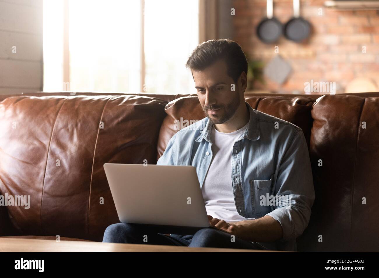Focused adult student, remote employee using laptop Stock Photo - Alamy