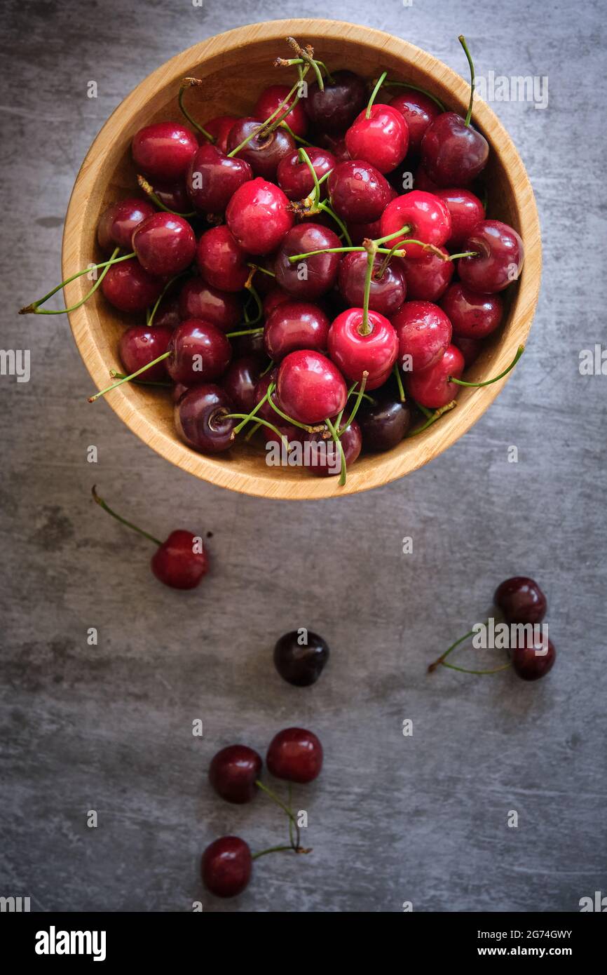 ripe cherries on a dark background Stock Photo - Alamy