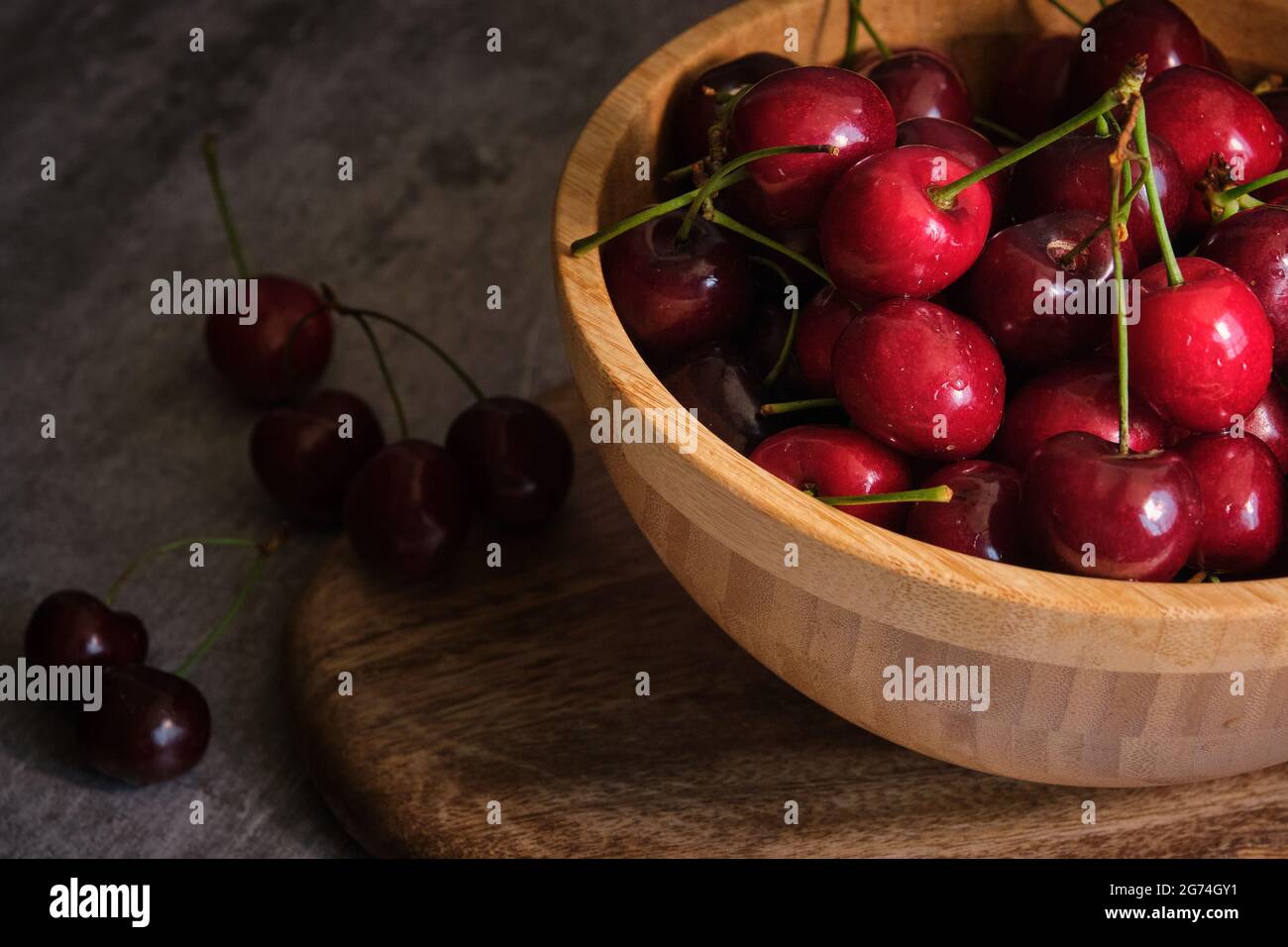 ripe cherries on a dark background Stock Photo