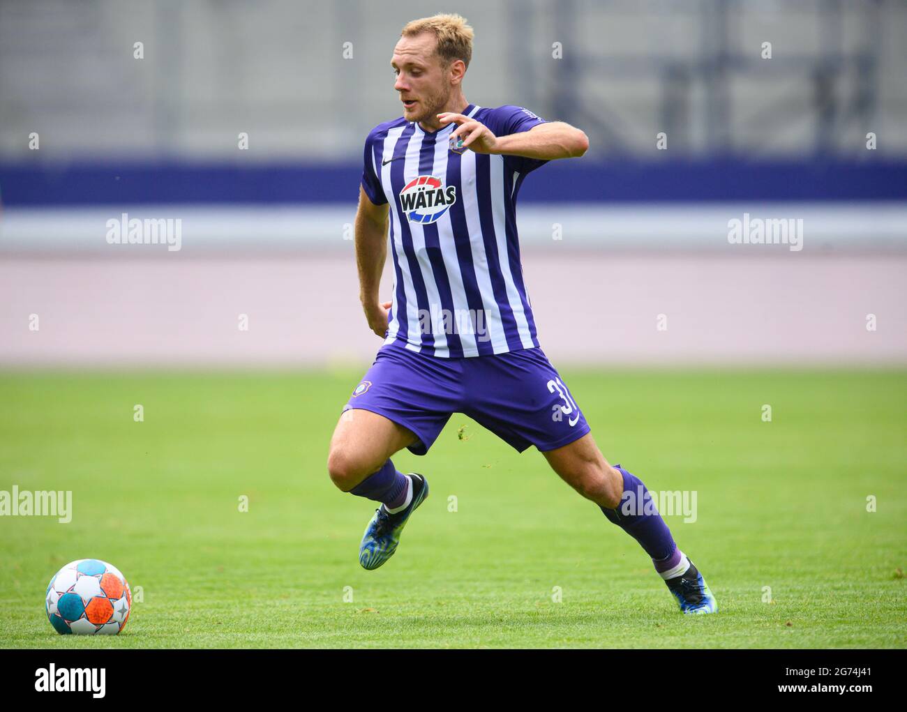 Aue, Germany. 10th July, 2021. Football: Test match, FC Erzgebirge Aue - 1. FC Magdeburg, at Erzgebirge Stadium. Aue's Ben Zolinski plays the ball. Credit: Robert Michael/dpa-Zentralbild/dpa - IMPORTANT NOTE: In accordance with the regulations of the DFL Deutsche Fußball Liga and/or the DFB Deutscher Fußball-Bund, it is prohibited to use or have used photographs taken in the stadium and/or of the match in the form of sequence pictures and/or video-like photo series./dpa/Alamy Live News Stock Photo