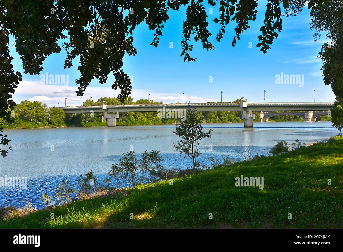 Bank of the Rhone and brige at Beaucaire, a commune in the Gard department in the Occitanie region of southern France Stock Photo
