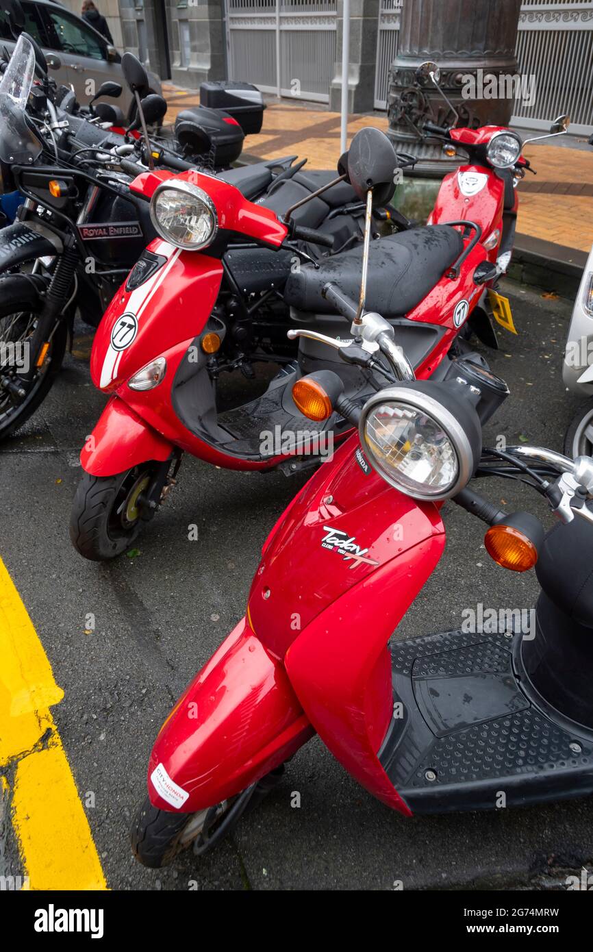 Motor scooters and motor bikes parked in central city, Wellington, North Island, New Zealand Stock Photo