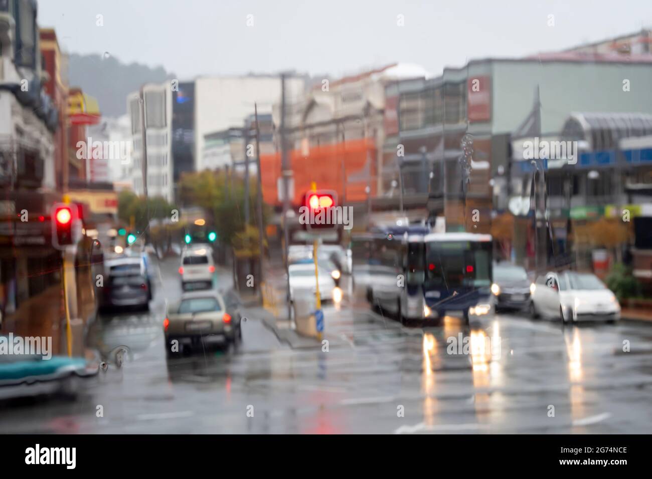 Cars and Buses on city street in heavy rain, Courtney Place, Wellington, North Island, New Zealand Stock Photo