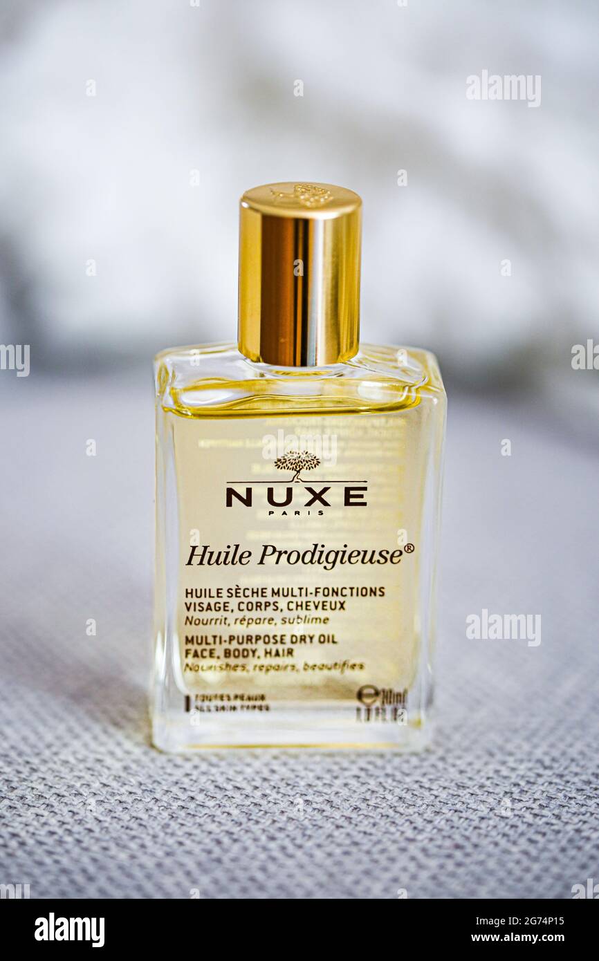Huile prodigieuse by Nuxe. Bottle on a light grey background Stock Photo
