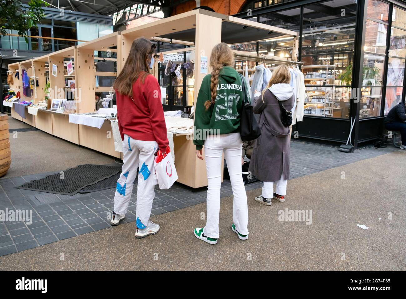 Spitalfields Market interior after covid pandemic lockdown restrictions ease and shoppers looking at stalls in East London UK May 2021   KATHY DEWITT Stock Photo