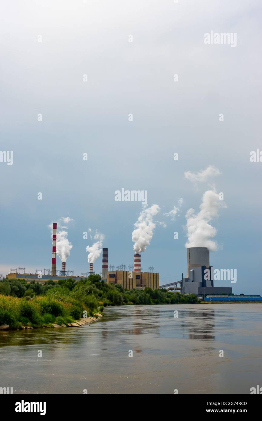 Panorama with a coal-fired power plant in Kozienice. Smoking stacks  and vapor from the cooling towers. Photo taken on a cloudy day with natural light Stock Photo