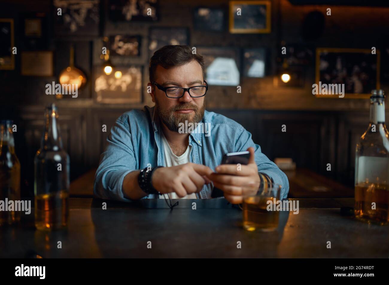 Resting man sitting bar alone hi-res stock photography and images - Alamy