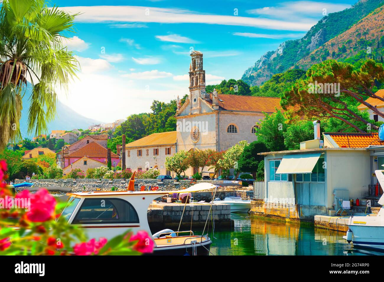 Embankment in small montenegrin town Prcanj at sunset, Montenegro Stock Photo