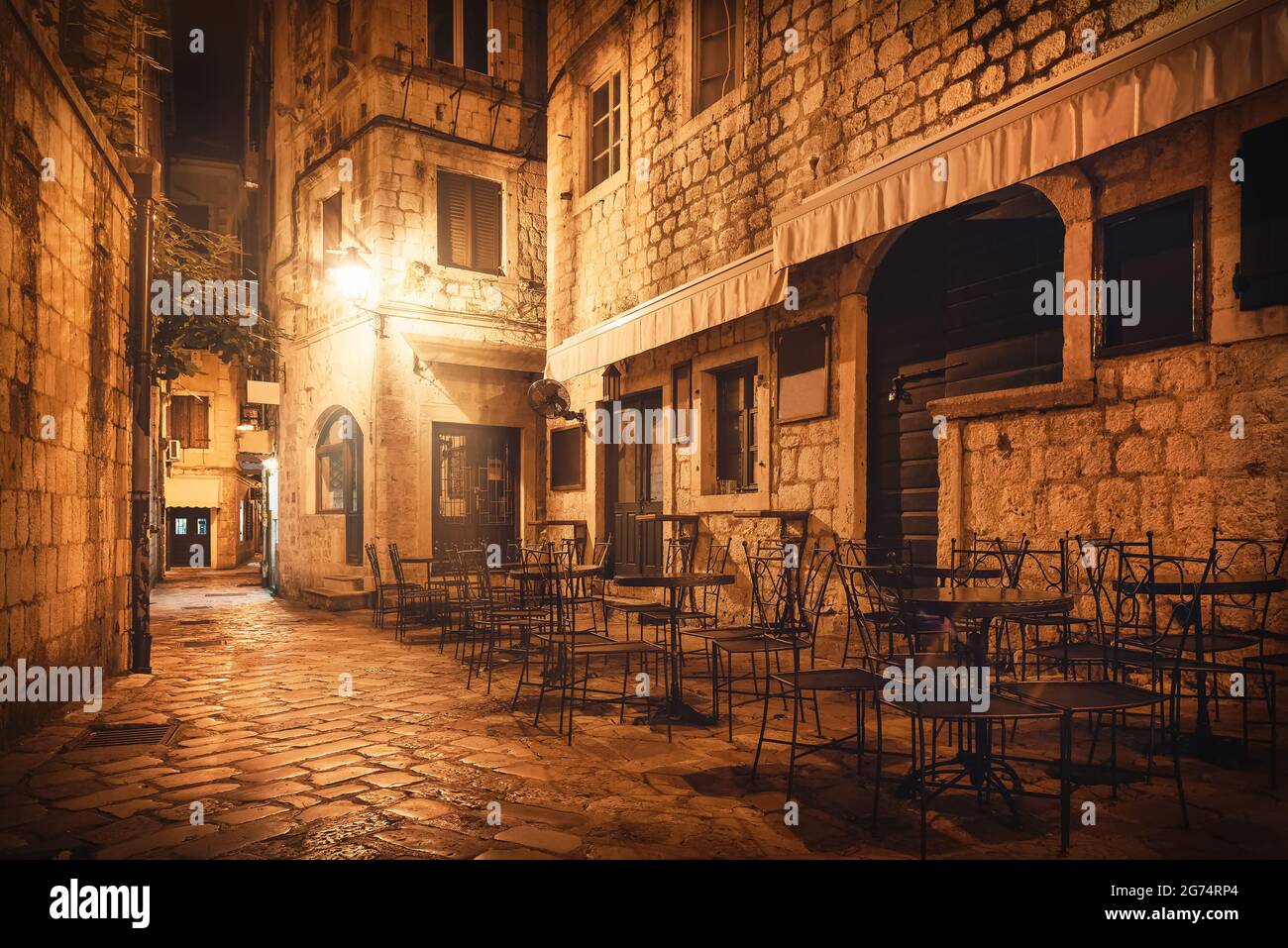 Street cafe in Old Town of Kotor at night Stock Photo