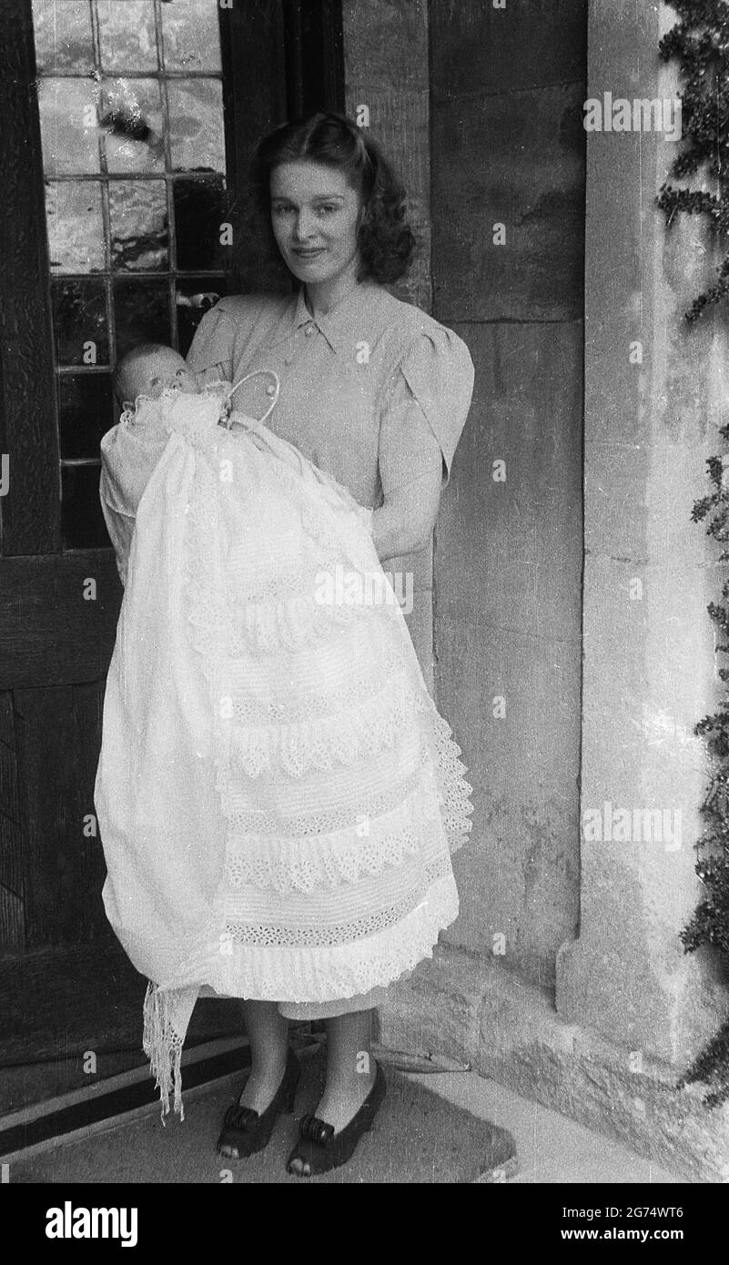 1950s, historical, christening, at an entrance to a house, a mother