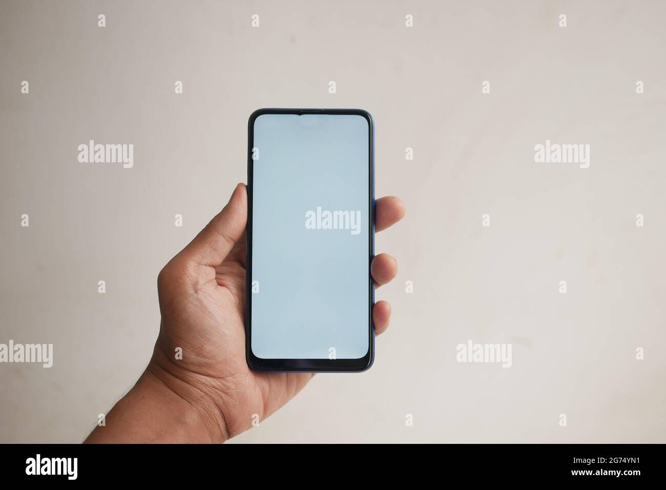 Close up of young man hand using smart phone with green screen Stock ...