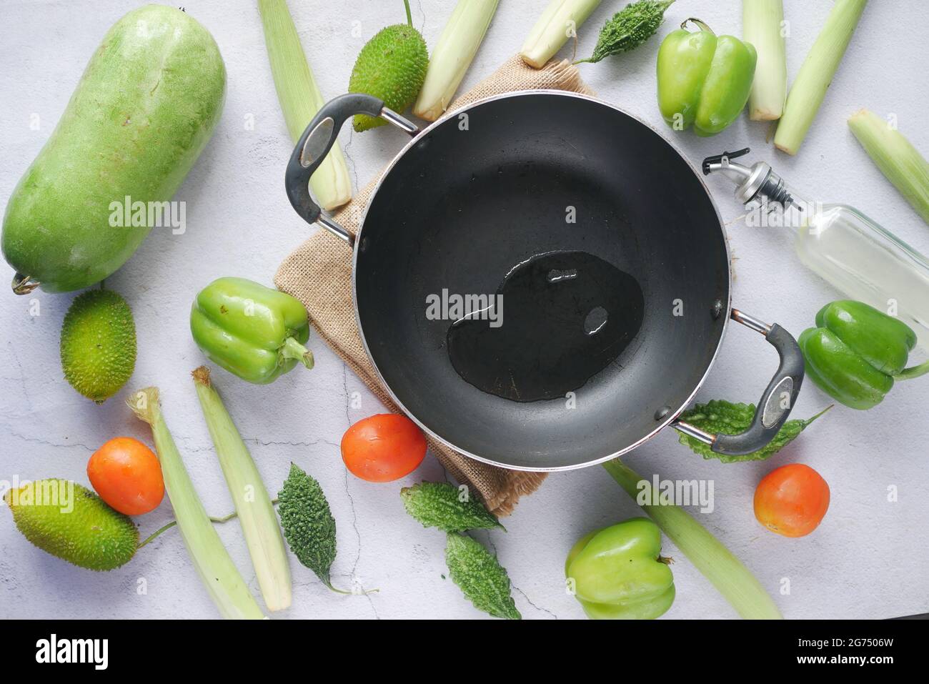 Pouring vegetable oil into frying pan Stock Photo Alamy