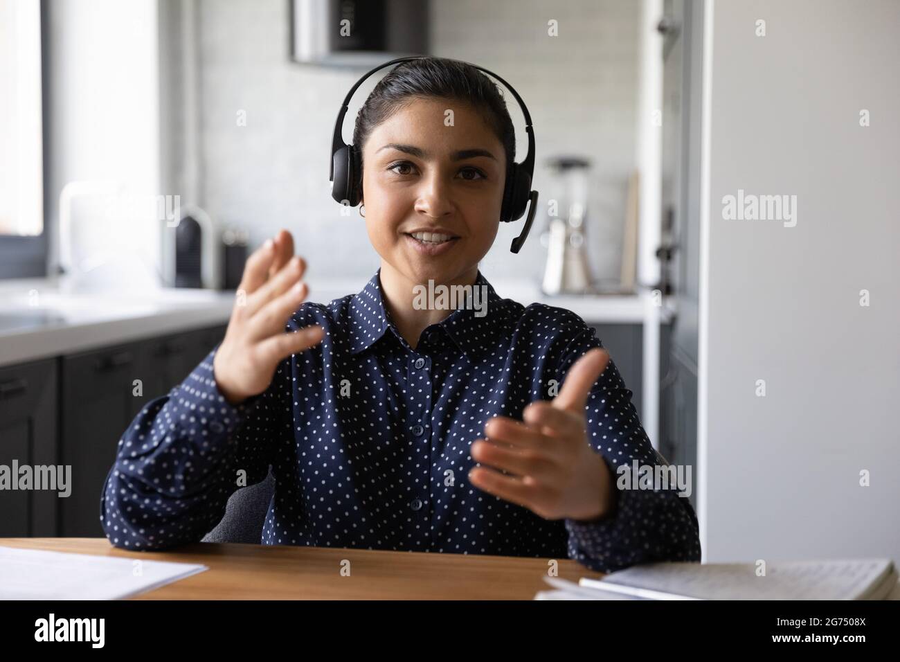 Happy funny Indian student wearing headphones looking at webcam Stock Photo  - Alamy