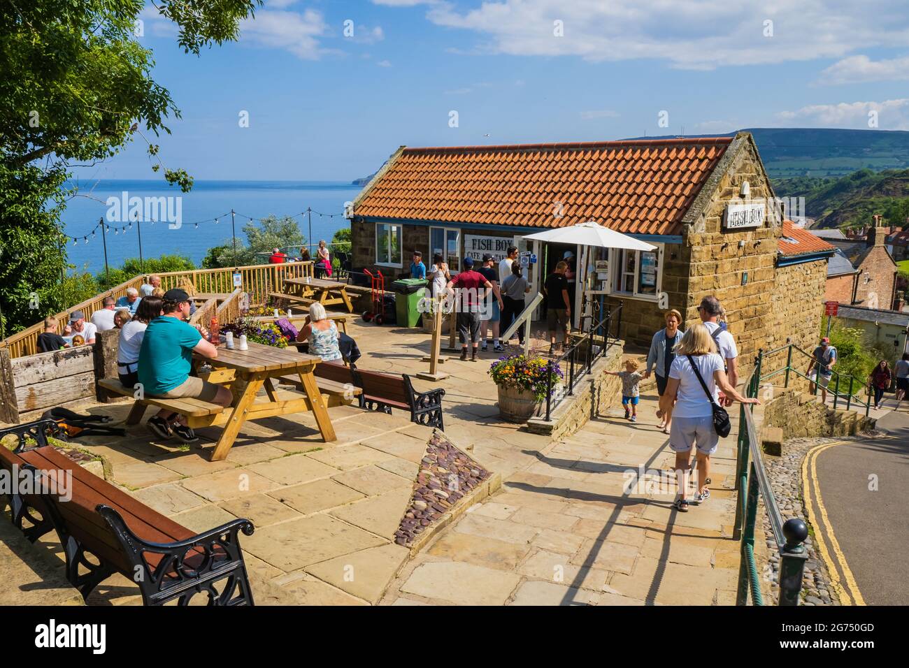 08.07.21 Robin Hodds Bay, North Yorkshire, UK. eating fish and chips at