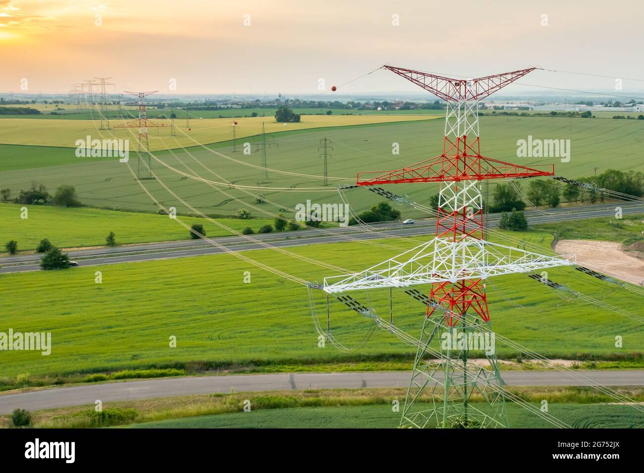 Aerial view of electric power transmission lines at sunset Stock Photo