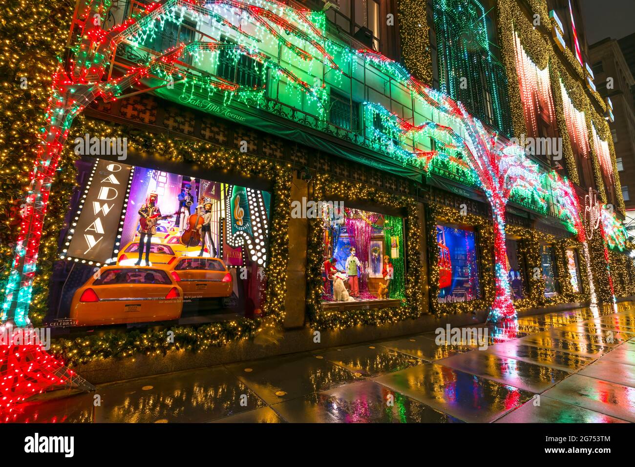 SAKS Fifth Avenue Christmas Light Show glows In the rainy night amidst COVID-19 Stock Photo