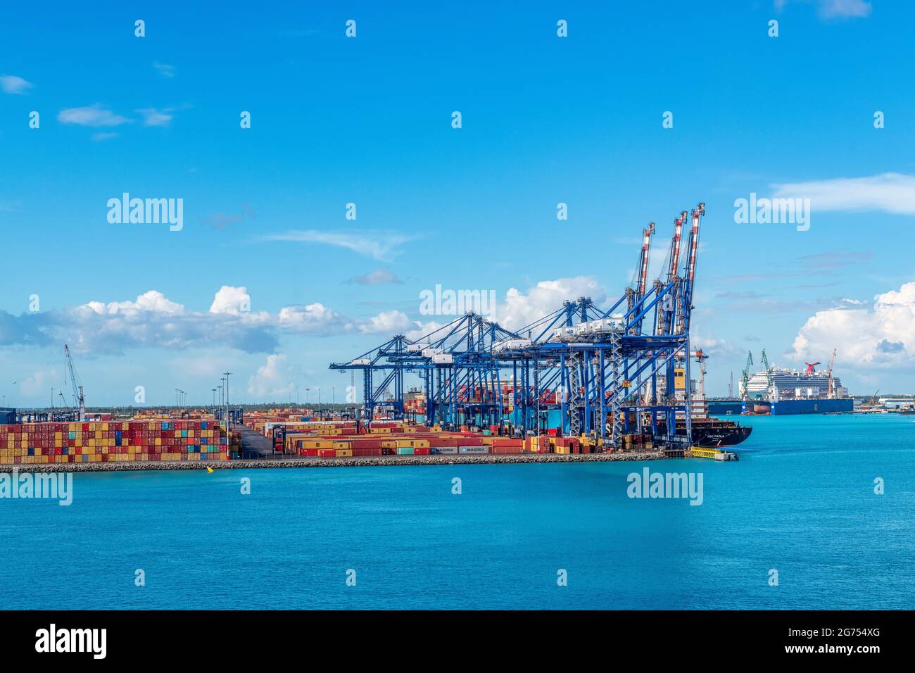 Freight cargo cranes in the port of Freeport, Bahamas Stock Photo