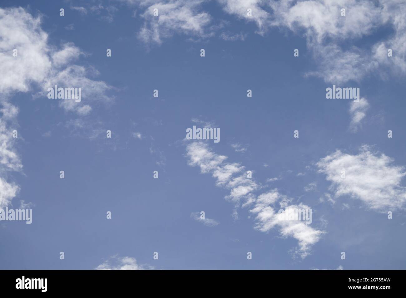 Blue sky with Cumulus Clouds background Stock Photo - Alamy