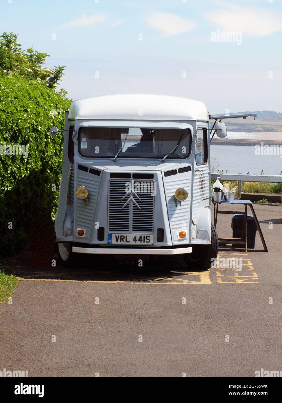 A vintage Citroen H.Y. four door pane light commercial van selling hot and cold food beverages at a Tynemouth seaside location in the UK. Stock Photo