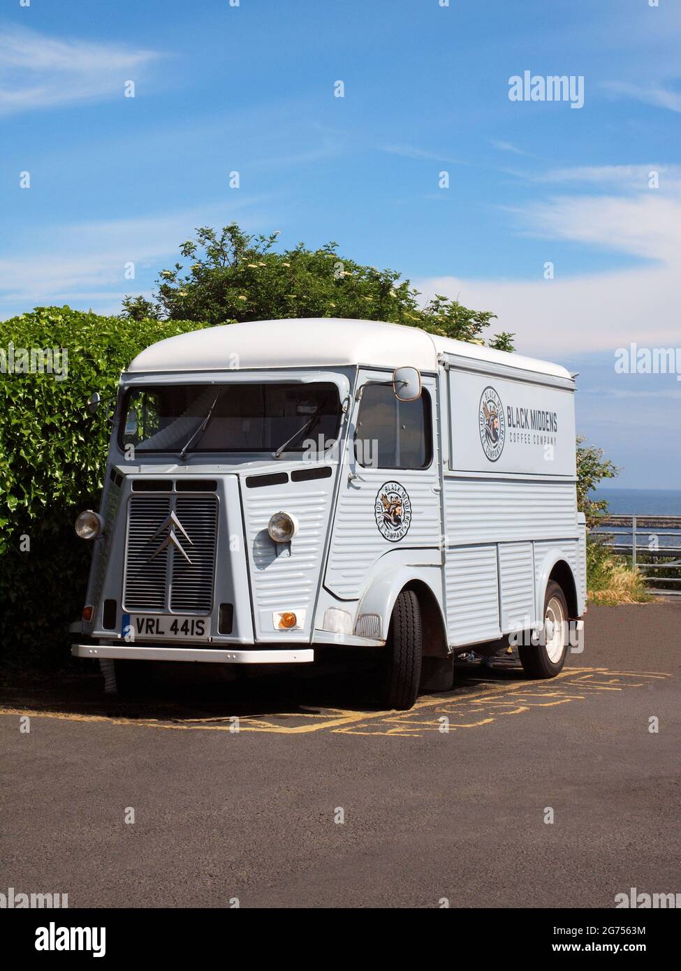 A vintage Citroen H.Y. four door pane light commercial van selling hot and cold food beverages at a Tynemouth seaside location in the UK. Stock Photo